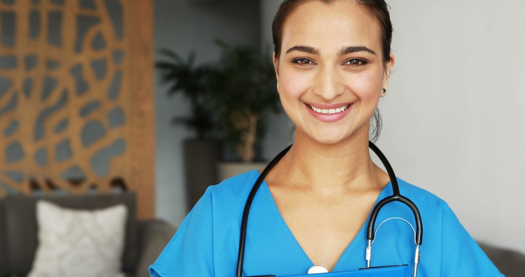 Smiling Nurse in Uniform with Stethoscope and Clipboard in Cozy Medical Facility - Free Images, Stock Photos and Pictures on Pikwizard.com