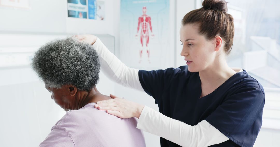 Female Physiotherapist Treating Elderly Woman with Shoulder Pain - Free Images, Stock Photos and Pictures on Pikwizard.com