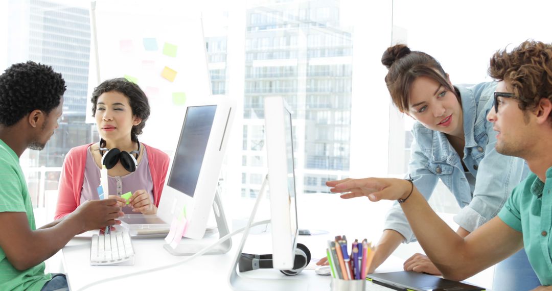 Young Diverse Team Brainstorming in Modern Office