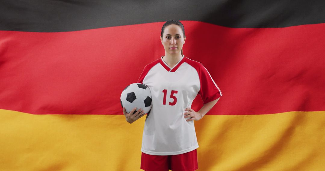 Female Soccer Player Standing Confidently Holds Soccer Ball, Germany Flag Background - Free Images, Stock Photos and Pictures on Pikwizard.com