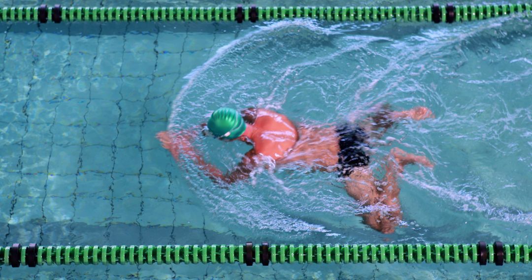 Professional Swimmer in Action Moving Through Lap Pool - Free Images, Stock Photos and Pictures on Pikwizard.com