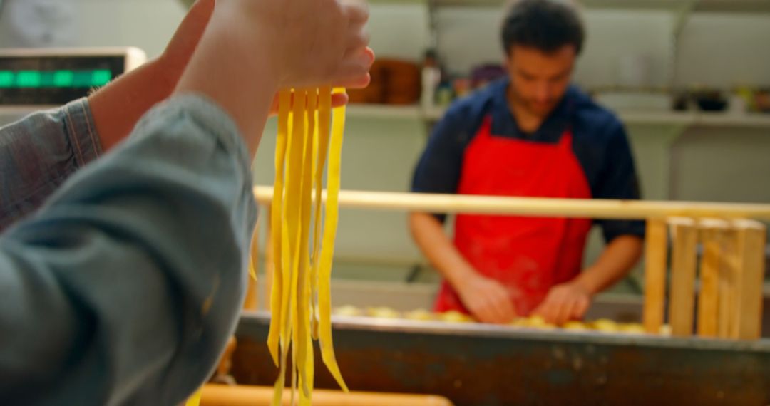 Handmade Pasta in Artisan Kitchen with Cooking Chef in Background - Free Images, Stock Photos and Pictures on Pikwizard.com