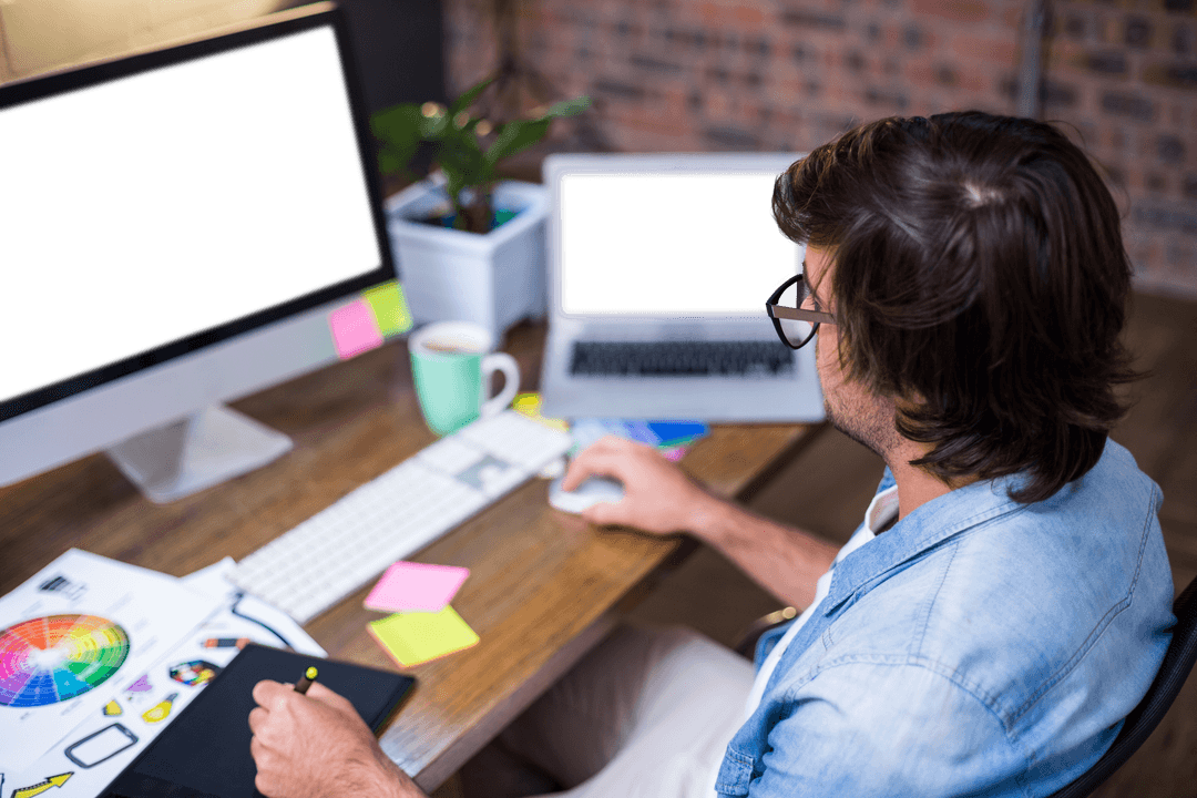 designer working at computer desk with transparent screens - Download Free Stock Images Pikwizard.com