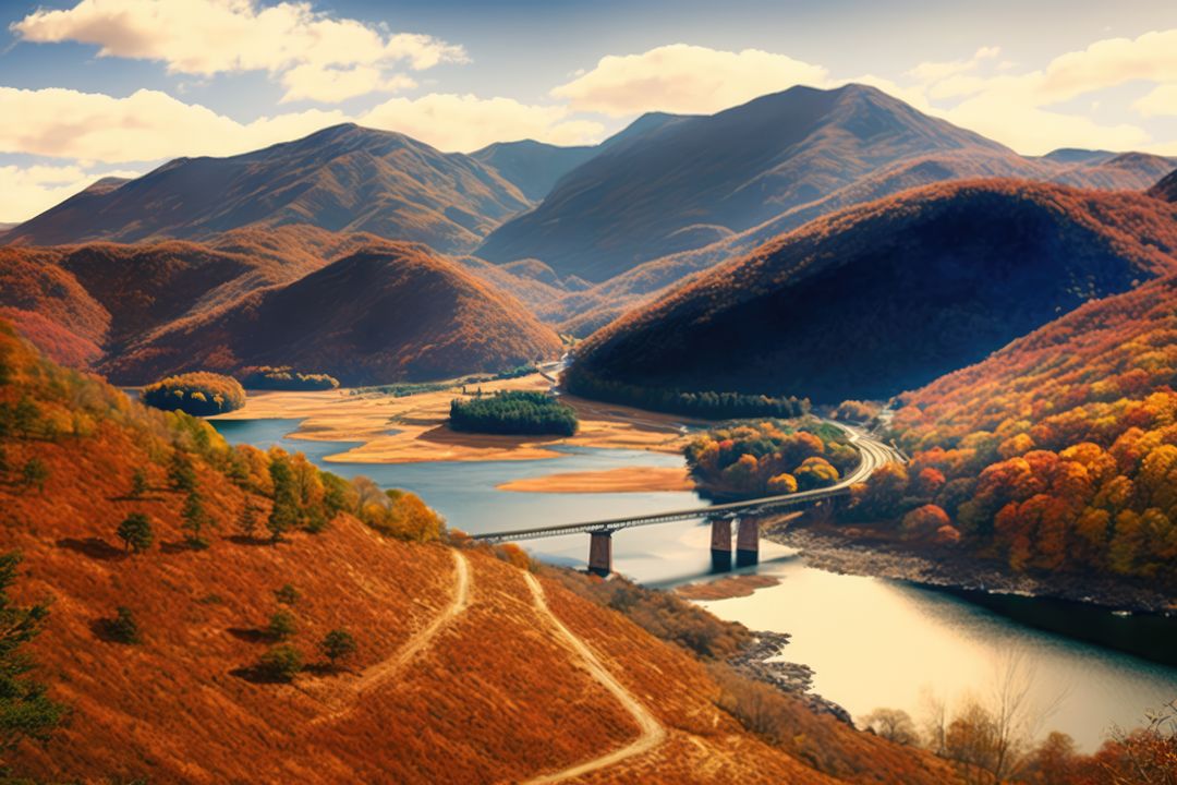 Picturesque mountain landscape with river, bridge, and autumn colors - Free Images, Stock Photos and Pictures on Pikwizard.com