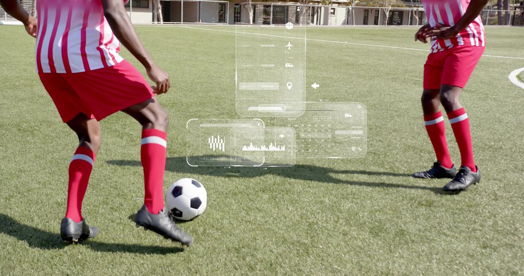 Two soccer players dribbling with augmented reality HUD overlays on training turf