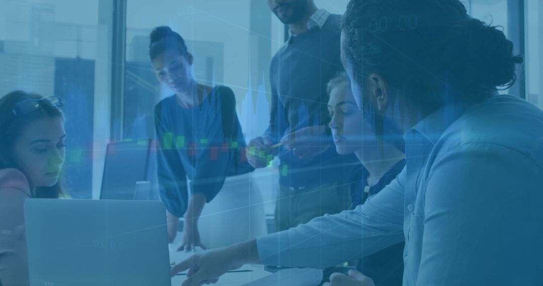 Team collaborating over laptop analyzing financial charts for data-driven decisions