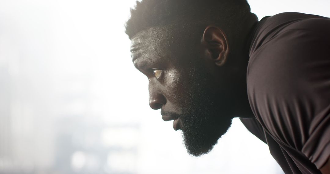 Focused Athlete Catching Breath After Intense Workout