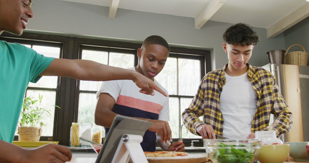 Teens Preparing Healthy Meal Together in Kitchen - Free Images, Stock Photos and Pictures on Pikwizard.com