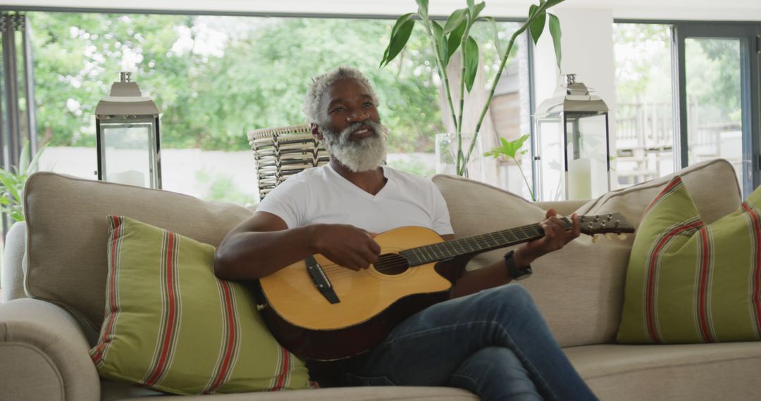 Image of sad african american senior man playing the guitar - Free Images, Stock Photos and Pictures on Pikwizard.com