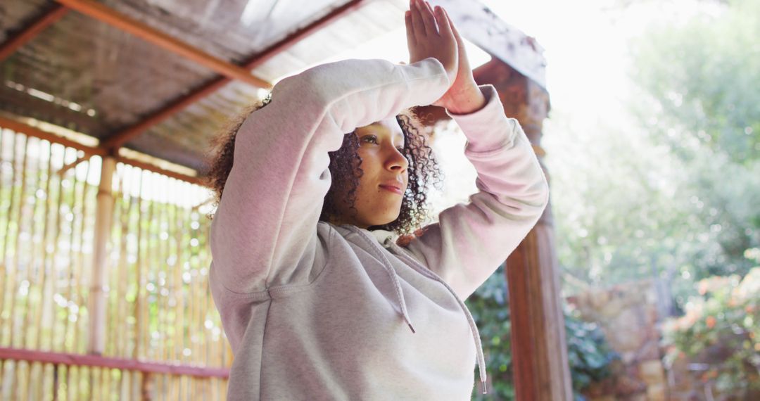 Woman Practicing Yoga Outdoors in Sunlit Garden - Free Images, Stock Photos and Pictures on Pikwizard.com