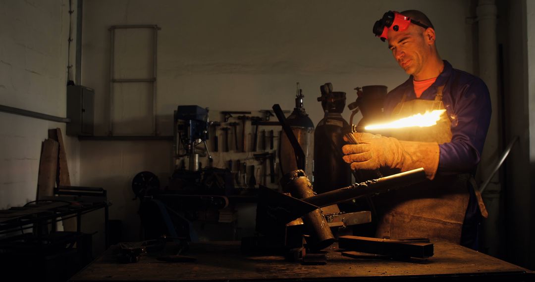 Skilled Metalworker Using Blowtorch in Workshop - Free Images, Stock Photos and Pictures on Pikwizard.com