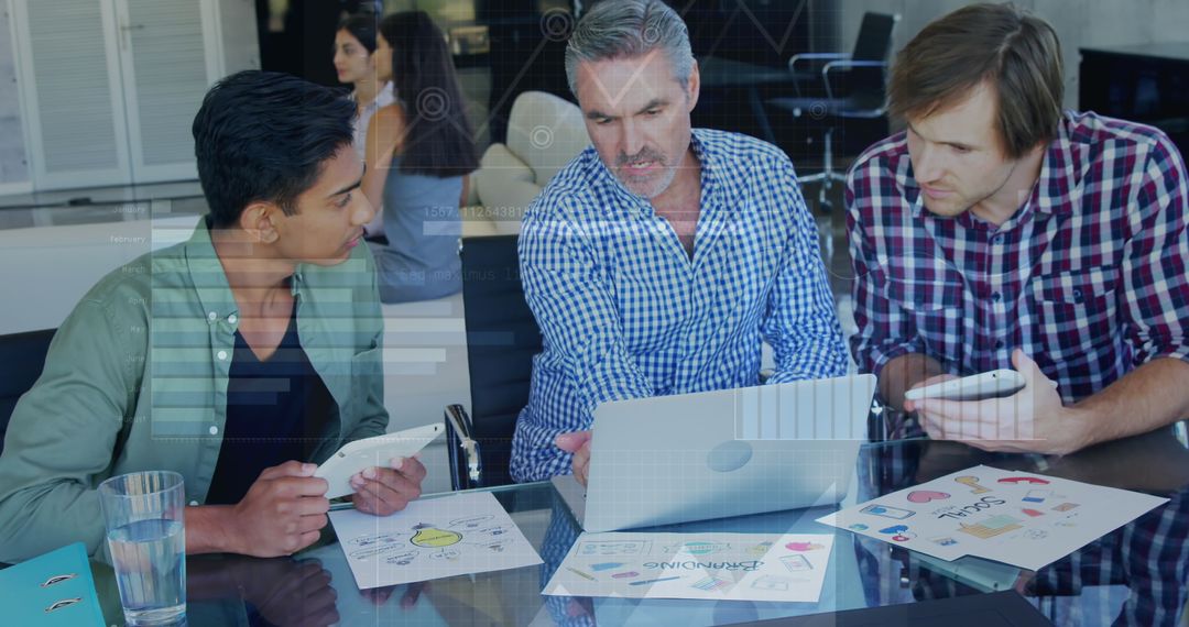 Diverse Team Collaborating on Business Strategy with Digital Interface