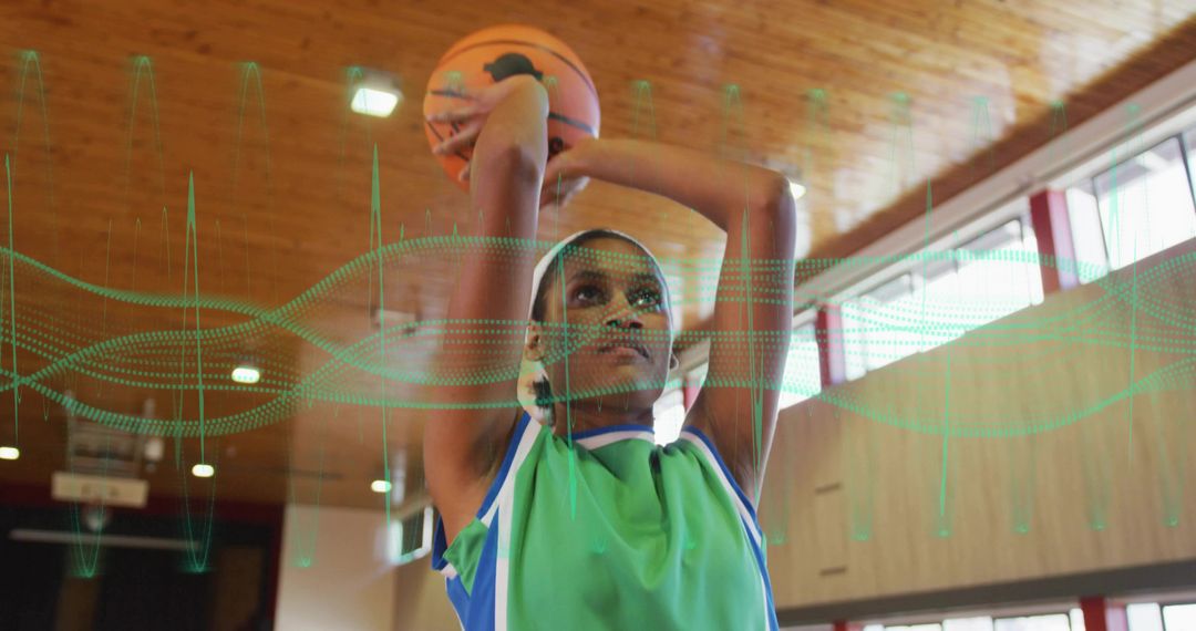 Female Basketball Player Practicing Shot in Indoor Gym