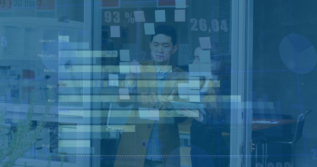 Business Professionals Analyzing Financial Data with a Digital Interface