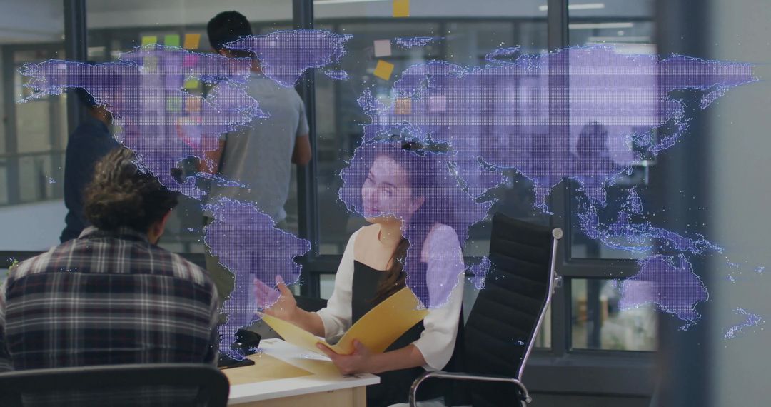 Team collaborating around virtual world map hologram in modern office brainstorming session