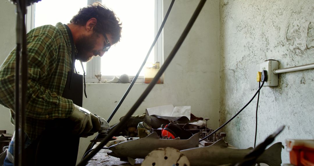 Artisan Sculptor Working on Metal Shark Project in Workshop - Free Images, Stock Photos and Pictures on Pikwizard.com