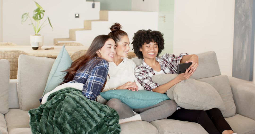 Diverse Friends Enjoying Time Together on Cozy Couch
