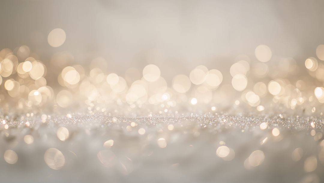 Golden bokeh glitter background with soft sparkling texture and warm light reflections