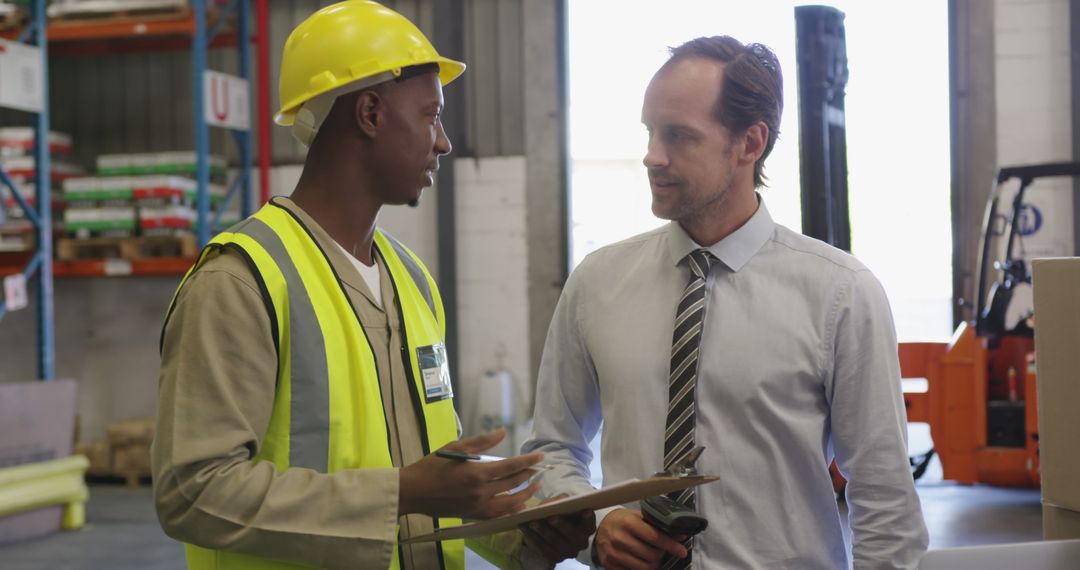 Warehouse Worker and Manager Collaborating on Logistics