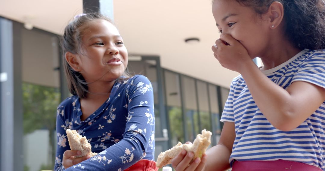 Laughing Friends Enjoying Lunch Outside School