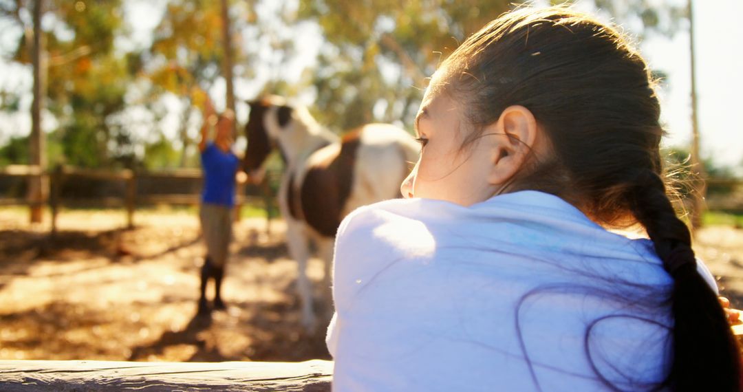 Girl Watching Man with Horse in Outdoor Rural Setting - Free Images, Stock Photos and Pictures on Pikwizard.com