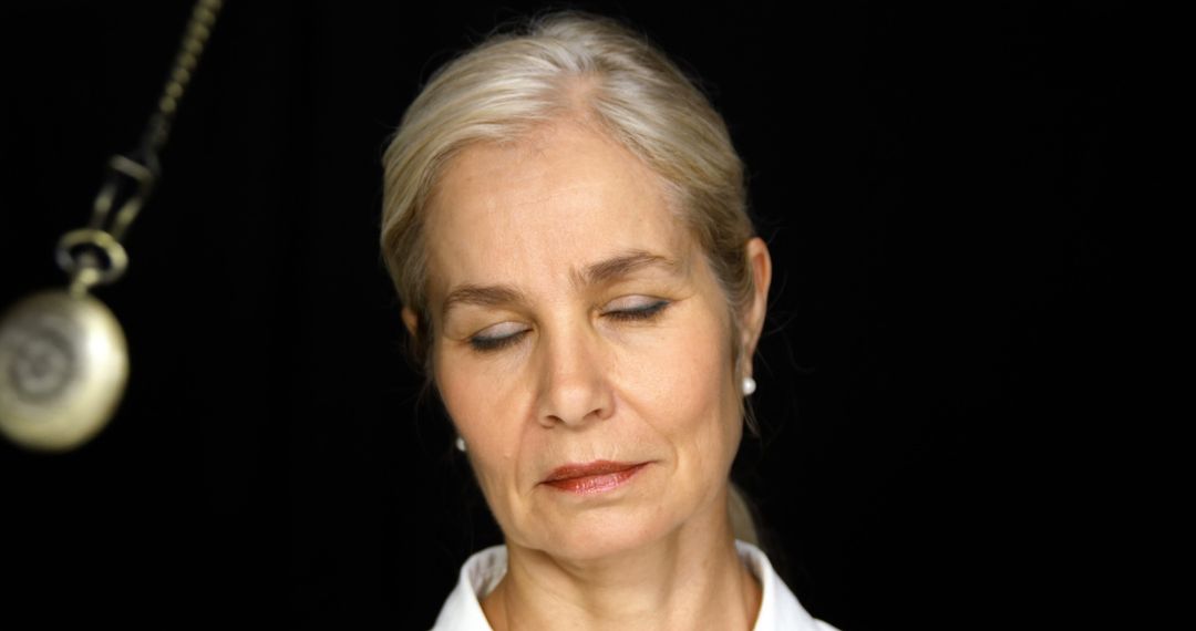 Close-up of Relaxed Mature Woman Under Hypnosis - Free Images, Stock Photos and Pictures on Pikwizard.com