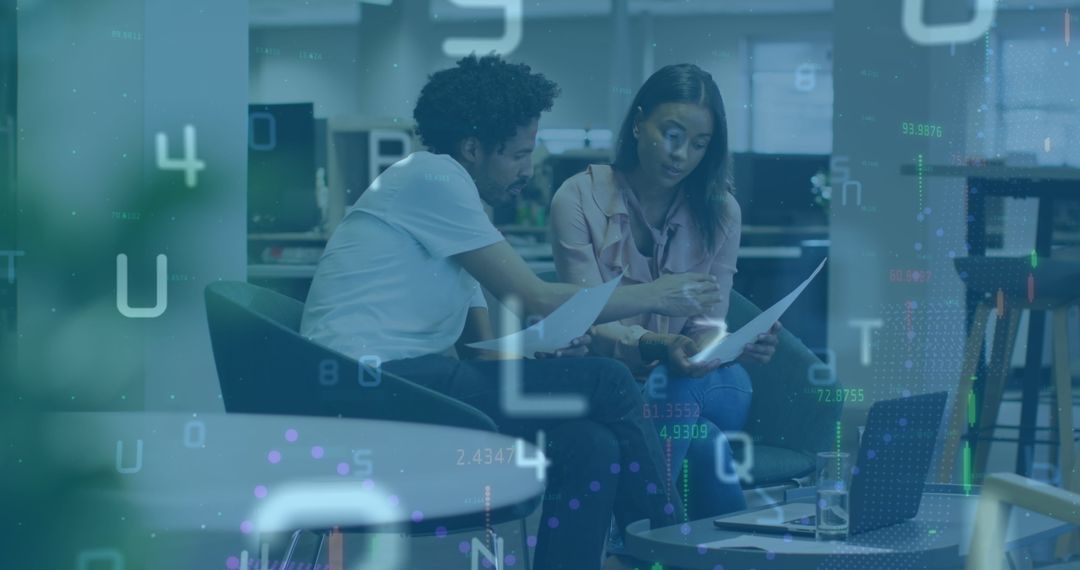 Diverse Coworkers Reviewing Data with Digital Overlay in Modern Office