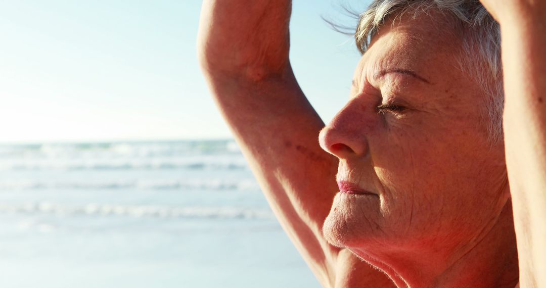 Active Senior Woman Practicing Yoga at Beach at Sunset - Free Images, Stock Photos and Pictures on Pikwizard.com