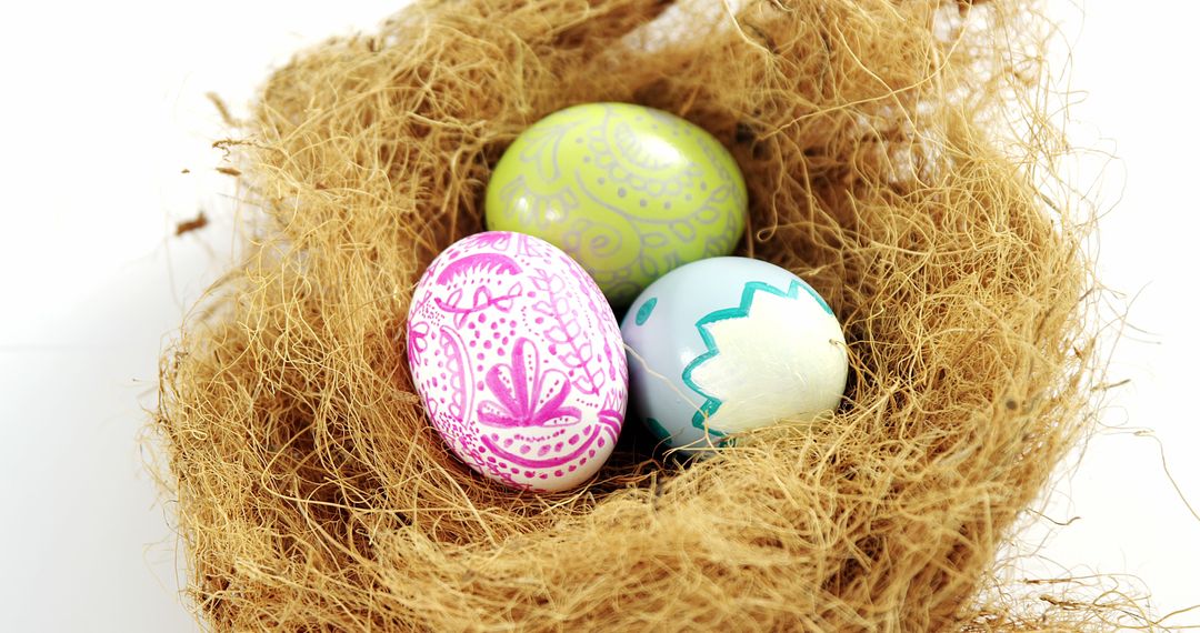 Colorful Decorated Easter Eggs Nestled in Natural Twig Nest - Free Images, Stock Photos and Pictures on Pikwizard.com