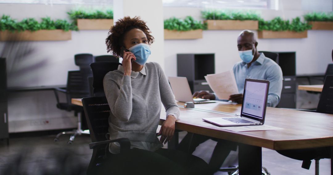 Office Workers Wearing Masks During Pandemic While Working - Free Images, Stock Photos and Pictures on Pikwizard.com