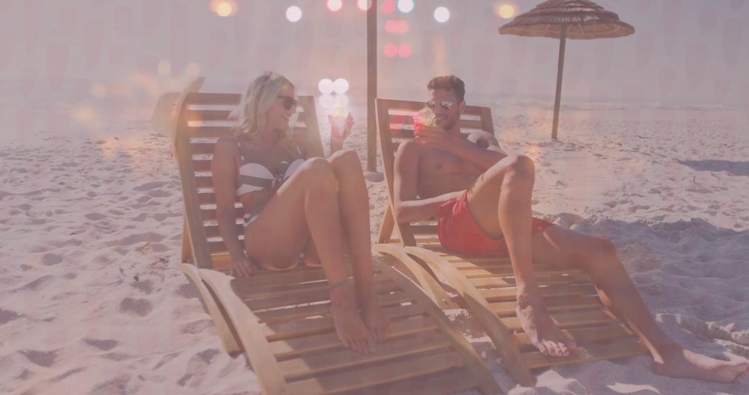 Couple Relaxing on Beach with Cocktails in Summer