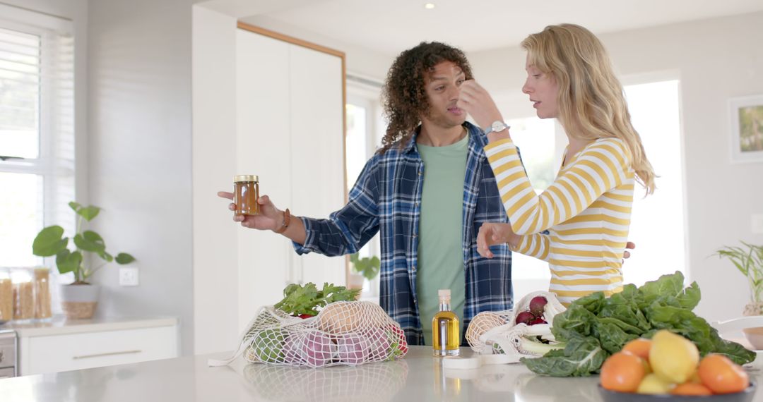 Diverse Couple Unpacking Organic Groceries at Home