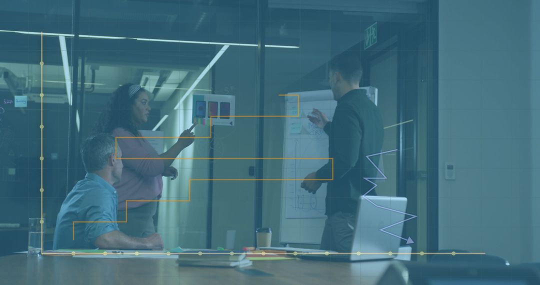 Business Team Analyzing Data with Graphical Interface