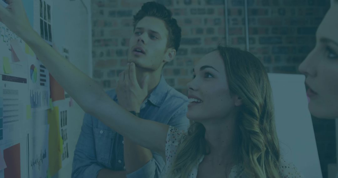 Creative Team Collaborating on Project with Visuals