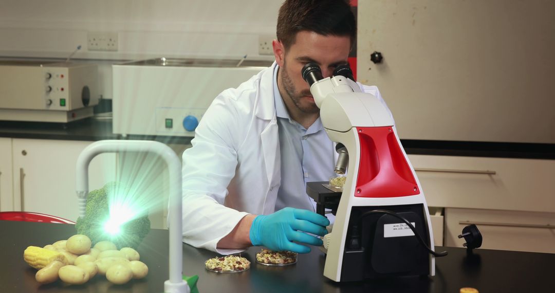 Scientist Examining Moss Samples through Microscope in Laboratory