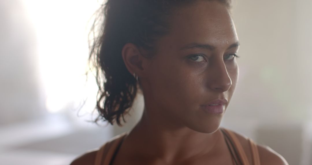 Female Athlete Intently Preparing in Gym Setting