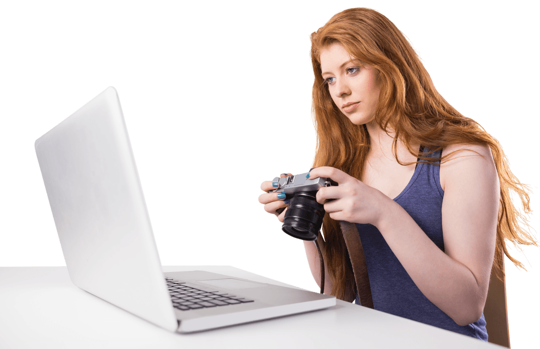 Transparent Tech-Savvy Redhead Editing Photos with Laptop