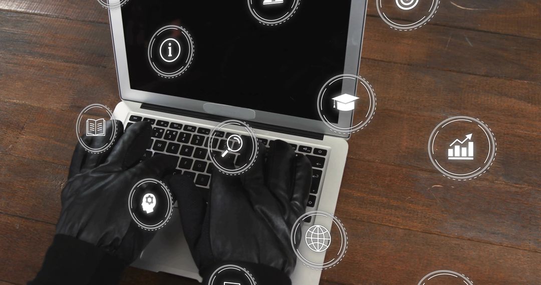 Black-Gloved Hands Typing on Laptop with Futuristic HUD Icons for Cybersecurity Threats