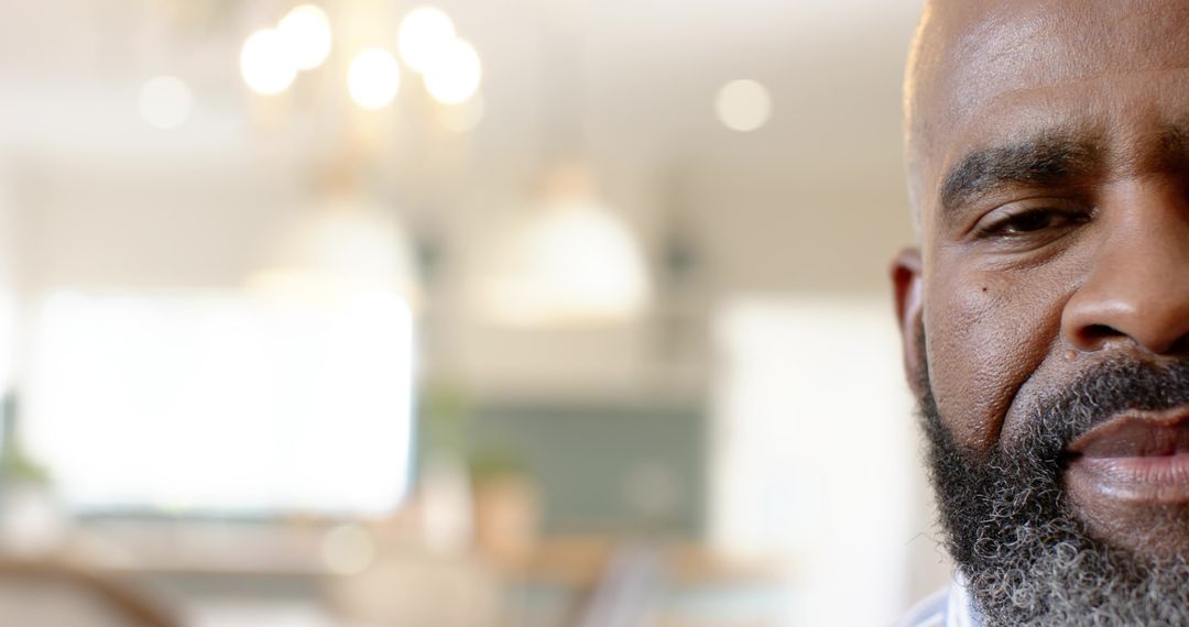 Contemplative Mature Man in Modern Minimalistic Kitchen