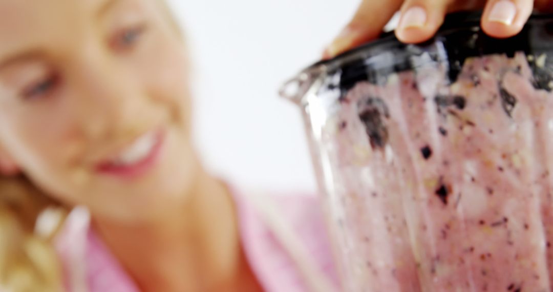 Woman Blending Fresh Berry Smoothie in Blender - Free Images, Stock Photos and Pictures on Pikwizard.com