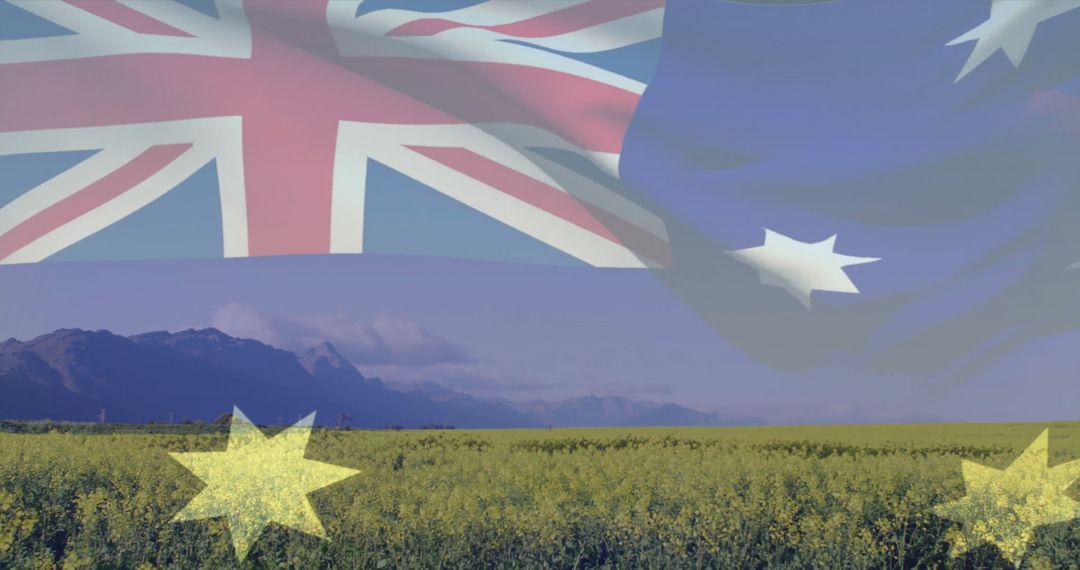 Australian Flag Over Canola Field with Mountain Backdrop