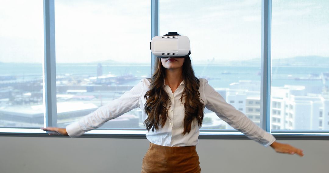 Woman Experiencing Virtual Reality in Office with Ocean View - Free Images, Stock Photos and Pictures on Pikwizard.com