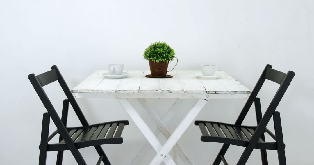 A serene minimalist dining area is accented with a marble table, black chairs, and greenery. - Free Images, Stock Photos and Pictures on Pikwizard.com