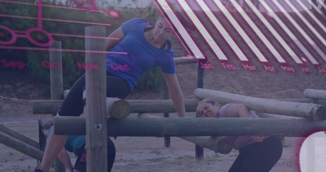 Women Conquering Outdoor Obstacle Course for Teamwork Challenge
