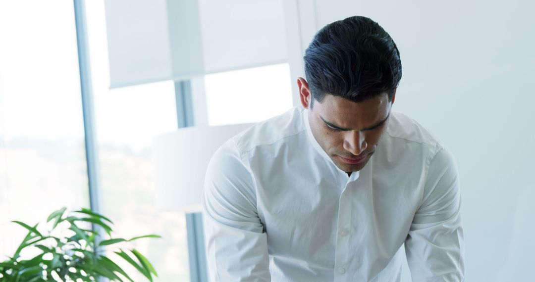 Focused Executive Man Engaging with Digital Tablet in Office