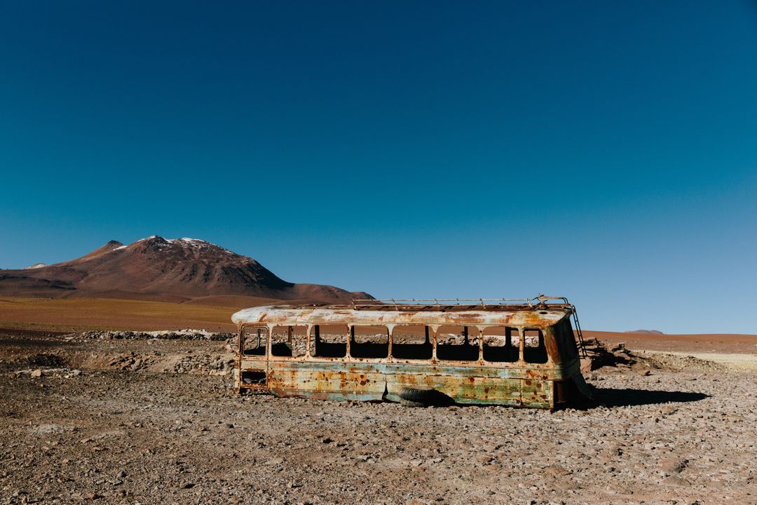 Abandoned Rusty Bus in Remote Desert Landscape with Mountains - Free Images, Stock Photos and Pictures on Pikwizard.com