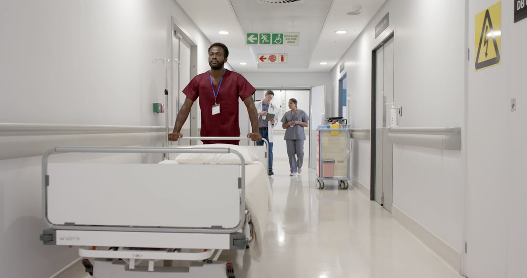 Nurse Transporting Patient on Hospital Bed in Corridor - Free Images, Stock Photos and Pictures on Pikwizard.com