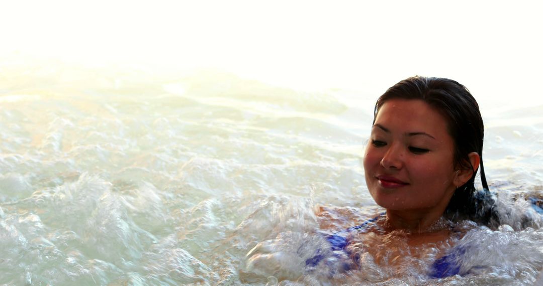 Woman Relaxing in Outdoor Pool at Sunset - Free Images, Stock Photos and Pictures on Pikwizard.com