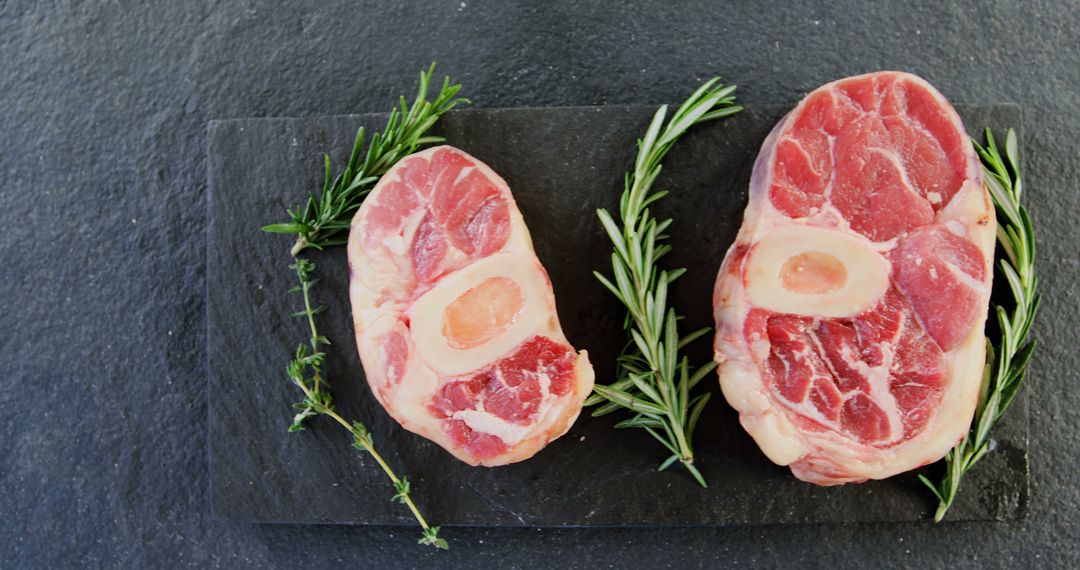 Raw Beef Shanks with Bone and Fresh Rosemary on Slate Board - Free Images, Stock Photos and Pictures on Pikwizard.com