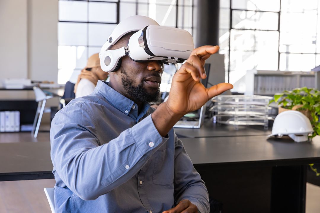 Engineer Experiencing Virtual Reality in Modern Office